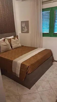 a bedroom with a large bed in a room at Estancia Azul by Fusion Market in Santo Domingo