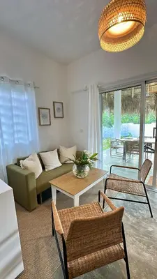 a living room with a couch and a table at Villa Turquesa En Dreams House - 5 pax, 2 min de la playa in Las Galeras