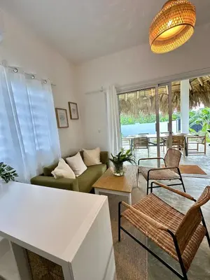 a living room with a couch and a table at Villa Turquesa En Dreams House - 5 pax, 2 min de la playa in Las Galeras