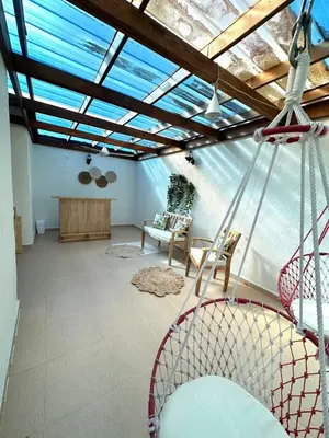 a room with a hammock in a room with a ceiling at Modern Penthouse Style Apt in Licey al Medio