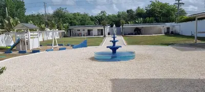 a fountain in the middle of a playground at Villas Caribe in Juan Dolio