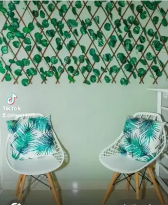 two chairs sitting next to each other in a room at Residencial Mediterraneo III in Santiago de los Caballeros