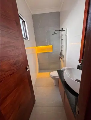 a bathroom with a sink and a toilet and a shower at Luxury Caribbean Oasis in La Romana