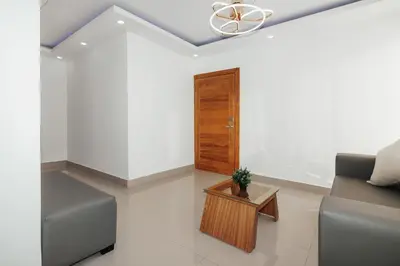 a living room with a couch and a table at Exclusive Top-Floor Penthouse with Jacuzzi - BlueCasas in Santiago de los Caballeros