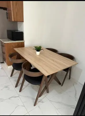 a wooden table with a potted plant on top of it at Condominio Esperanza B102 in San Pedro de Macorís