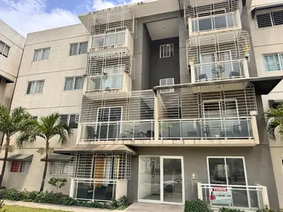 an apartment building with balconies on the side of it at Ocean View Fast Wifi Close to Everything Coffee 2BR in La Cana