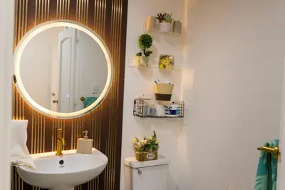 a bathroom with a sink and a mirror at Beautiful apartment on the 2nd floor in Boca Residence