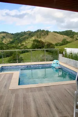 a swimming pool with a view of a hill at Villa lobos in Concepción de La Vega