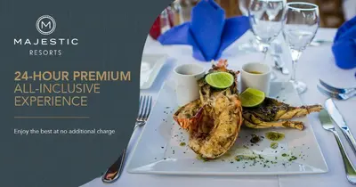 a plate of food with fish on a table at Majestic Mirage Punta Cana, All Suites – All Inclusive in Punta Cana