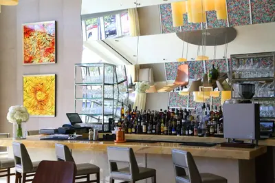 a bar with chairs and bottles of wine at InterContinental Real Santo Domingo by IHG in Santo Domingo