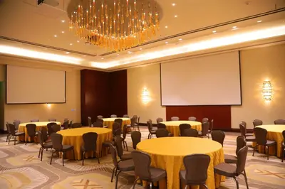 a conference room with tables and chairs and a chandelier at InterContinental Real Santo Domingo by IHG in Santo Domingo