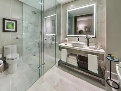 a bathroom with a sink and a glass shower at InterContinental Real Santo Domingo by IHG in Santo Domingo
