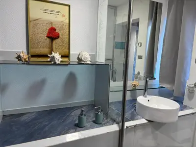 a bathroom with a sink and a mirror at Sunset Samana in Las Galeras