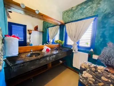 a bathroom with a sink and a mirror at Sunset Samana in Las Galeras