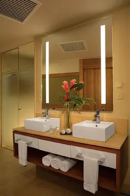 a bathroom with two sinks and a large mirror at Dreams Onyx Resort & Spa - All Inclusive in Punta Cana