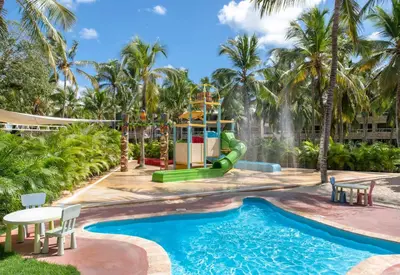 a playground at a resort with a slide at Viva Dominicus Beach by Wyndham, A Trademark All Inclusive in Bayahibe