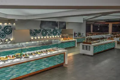 a buffet line with many different types of food at Viva Dominicus Palace by Wyndham, A Trademark All Inclusive in Bayahibe