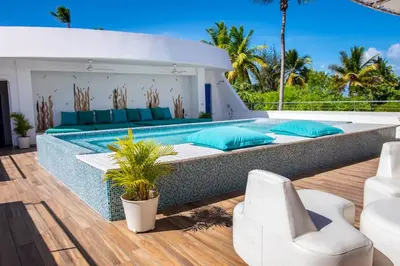 a villa with a swimming pool on a deck at Puerto Plaza Las Terrenas in Las Terrenas