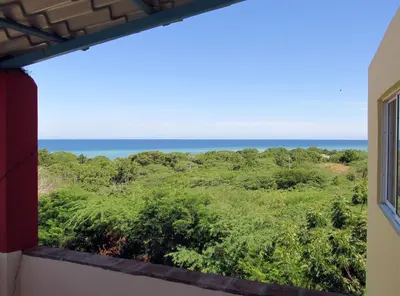 a view of the ocean from a window at Corales Punta Rusia in Punta Rucia