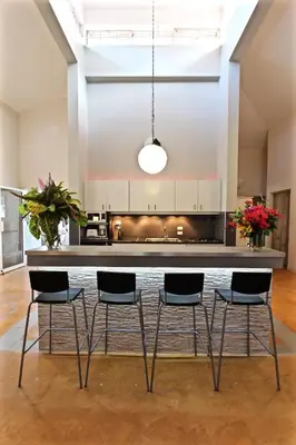 a kitchen with a table and chairs in a room at Villa Talanquera in Las Galeras