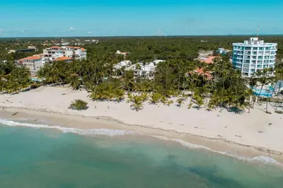 an aerial view of a beach in front of a resort at Amazing Apartments, A-Juan Dolio, El Bonito II in Juan Dolio