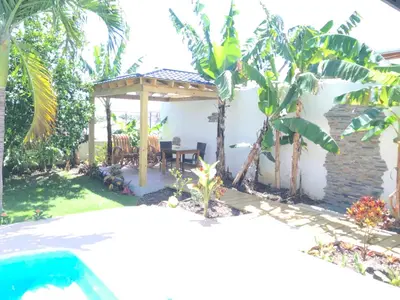 a backyard with a gazebo and a pool at Centro de Santiago in Santiago de los Caballeros