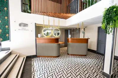 a view of the lobby of a hotel with a bar at Gran Hotel Europa Santo Domingo Trademark Collection by Wyndham in Santo Domingo