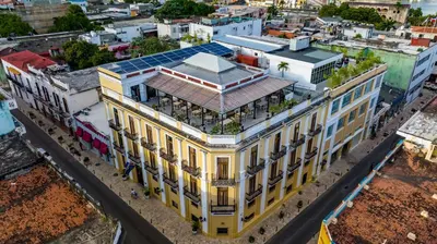an overhead view of a yellow building with windows at Gran Hotel Europa Santo Domingo Trademark Collection by Wyndham in Santo Domingo