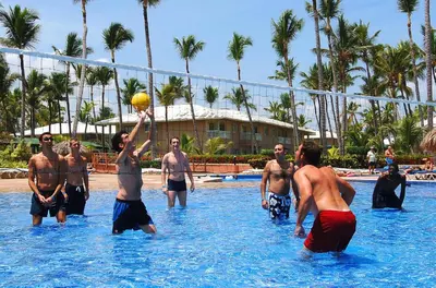 a group of men playing a game in the water at Grand Sirenis Punta Cana Resort & Aquagames - All Inclusive in Punta Cana