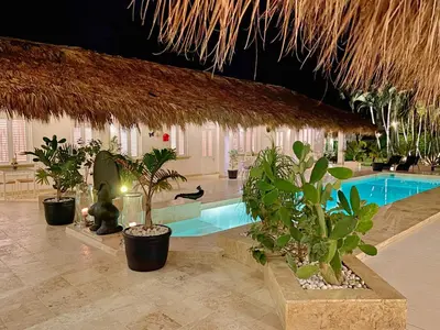 a resort with a swimming pool and some plants at Adults-Only Hacienda Terra Taina in Las Terrenas