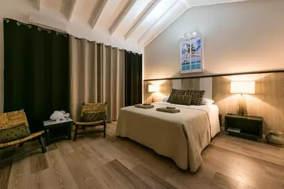 a bedroom with a bed and a green curtain at Adults-Only Hacienda Terra Taina in Las Terrenas