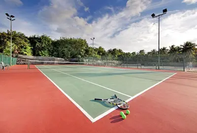 a tennis court with a bunch of tennis balls on it at Grand Palladium Select Bávaro - All Inclusive in Punta Cana