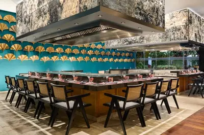a long bar with chairs at a restaurant at Grand Palladium Palace Resort Spa & Casino - All Inclusive in Punta Cana