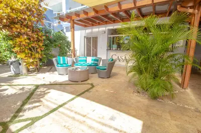 a group of blue chairs sitting on a patio at Casa Valeria Boutique Hotel in Sosúa