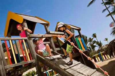 a group of children playing on a playground at VIK hotel Arena Blanca in Punta Cana