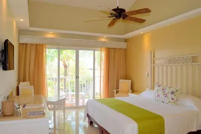 a bedroom with a bed and a ceiling fan at VIK hotel Arena Blanca in Punta Cana