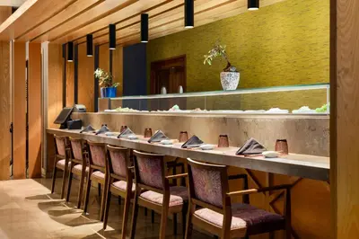 a long table in a restaurant with chairs at TRS Turquesa Hotel - Adults Only - All Inclusive in Punta Cana