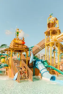 a water park with a water slide in the water at Hard Rock Hotel & Casino Punta Cana - All Inclusive in Punta Cana