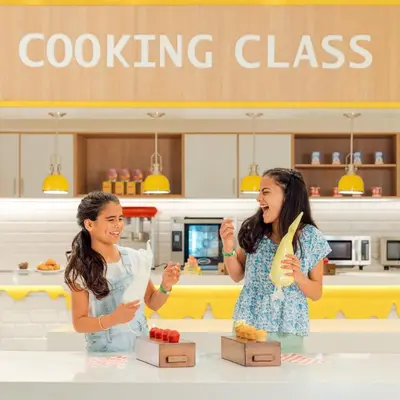 two women standing in front of a counter in a store at Hard Rock Hotel & Casino Punta Cana - All Inclusive in Punta Cana