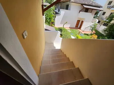 a stairway leading up to a building with yellow walls at Tamarindo in Bayahibe