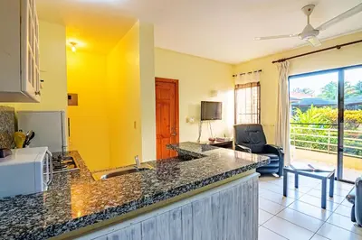 a kitchen with a sink and a counter top at D'Piero Hotel in Sosúa