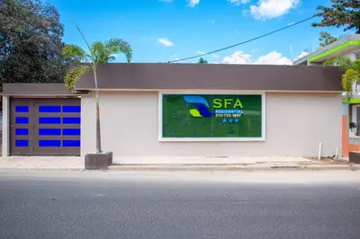 a building with a sfa sign on the side of it at Villa Elegante y Familiar en Pedernales, Cerca de la Playa del pueblo, Residencial SFA in Pedernales