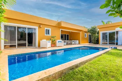 a swimming pool in front of a house at House 24 in Casa Linda in Sosúa