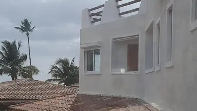 a white house with a window on top of a roof at Appartamento Cadaques Bayahibe in Bayahibe