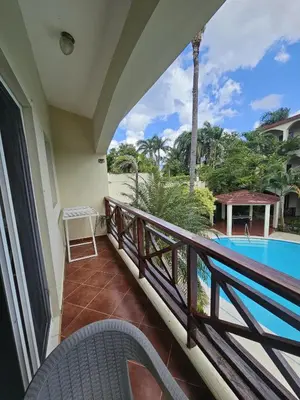 a balcony with a view of the pool at Apartamento en Las Terrenas in Las Terrenas