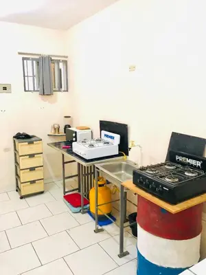 a kitchen with a counter top and a stove at Miami Studios DR in Santo Domingo