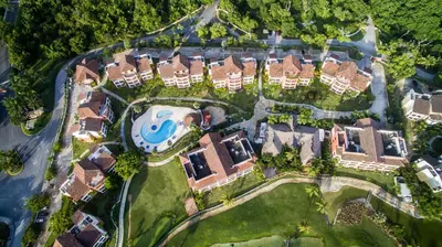 an aerial view of a house with a pool at Tot Punta Cana Apartments in Punta Cana