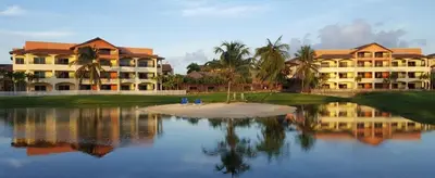 a resort with a body of water and buildings at Tot Punta Cana Apartments in Punta Cana