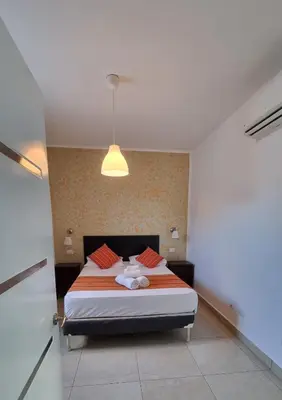a bedroom with a large bed in a room at Villa Roberta in Boca Chica