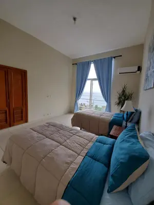 a bedroom with two beds and a window at Hidden Paradise at Apto Del Cerro in Santa Bárbara de Samaná